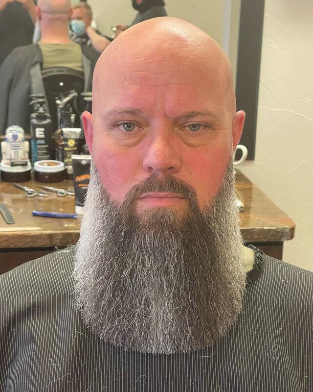 bald man with shaped beard