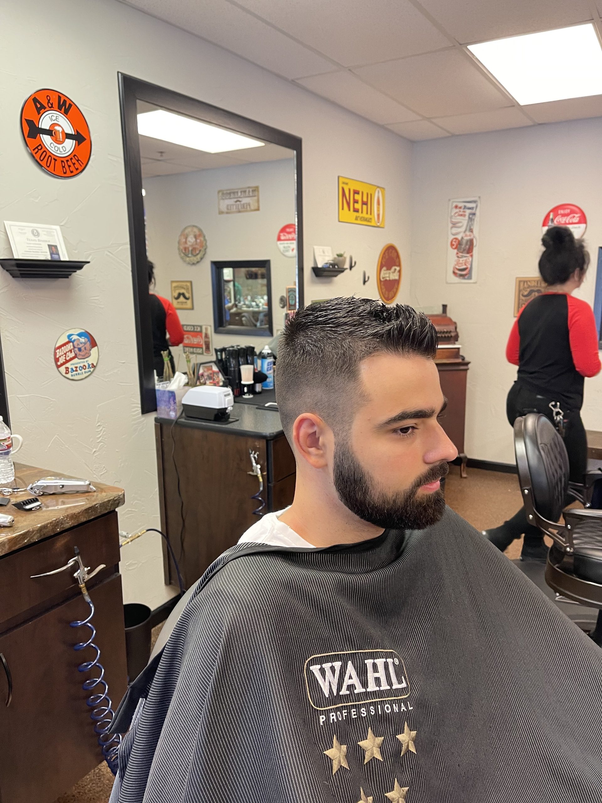 young man with fade and beard trim side view