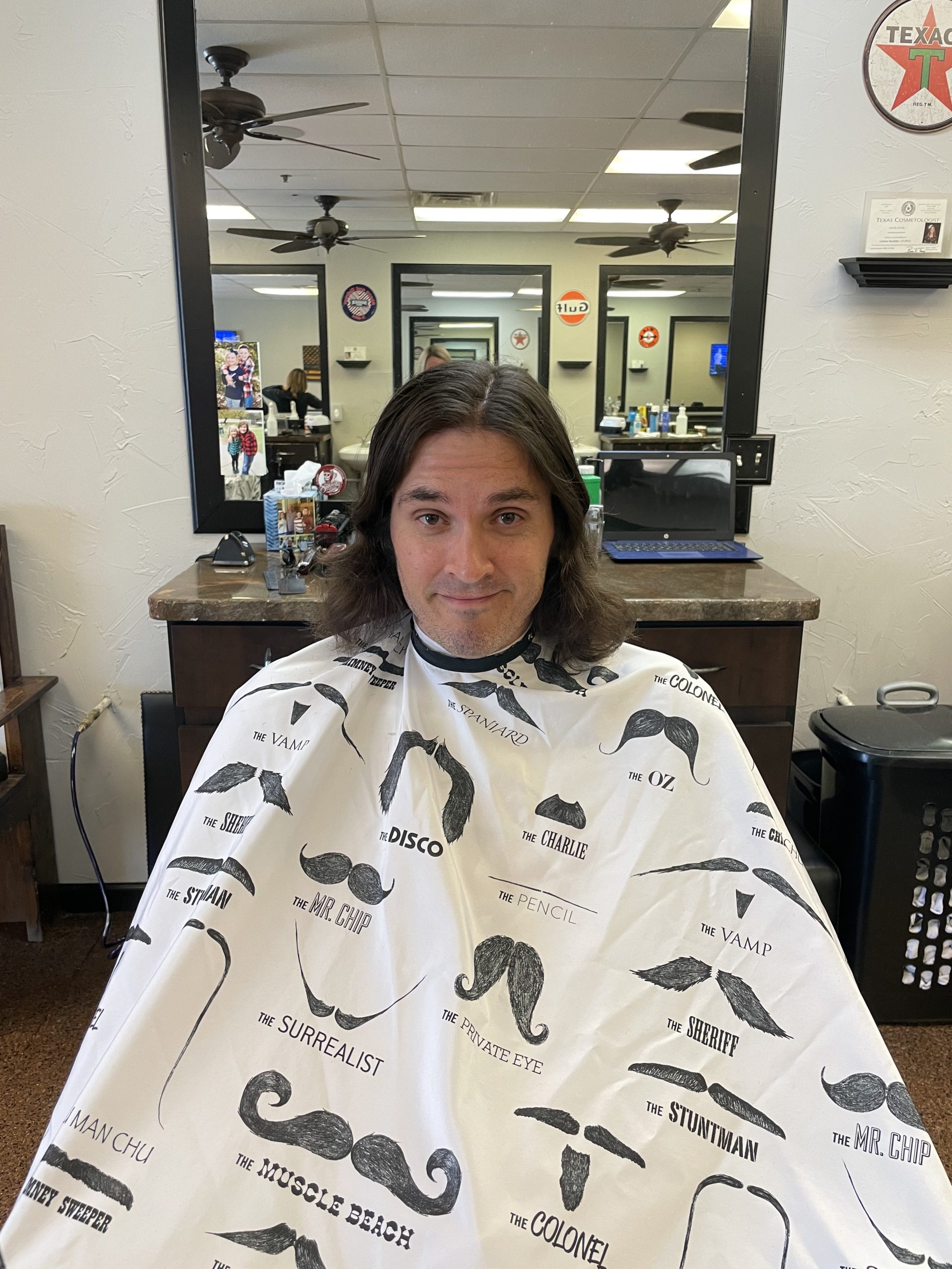 man with long hair about to get a hair cut