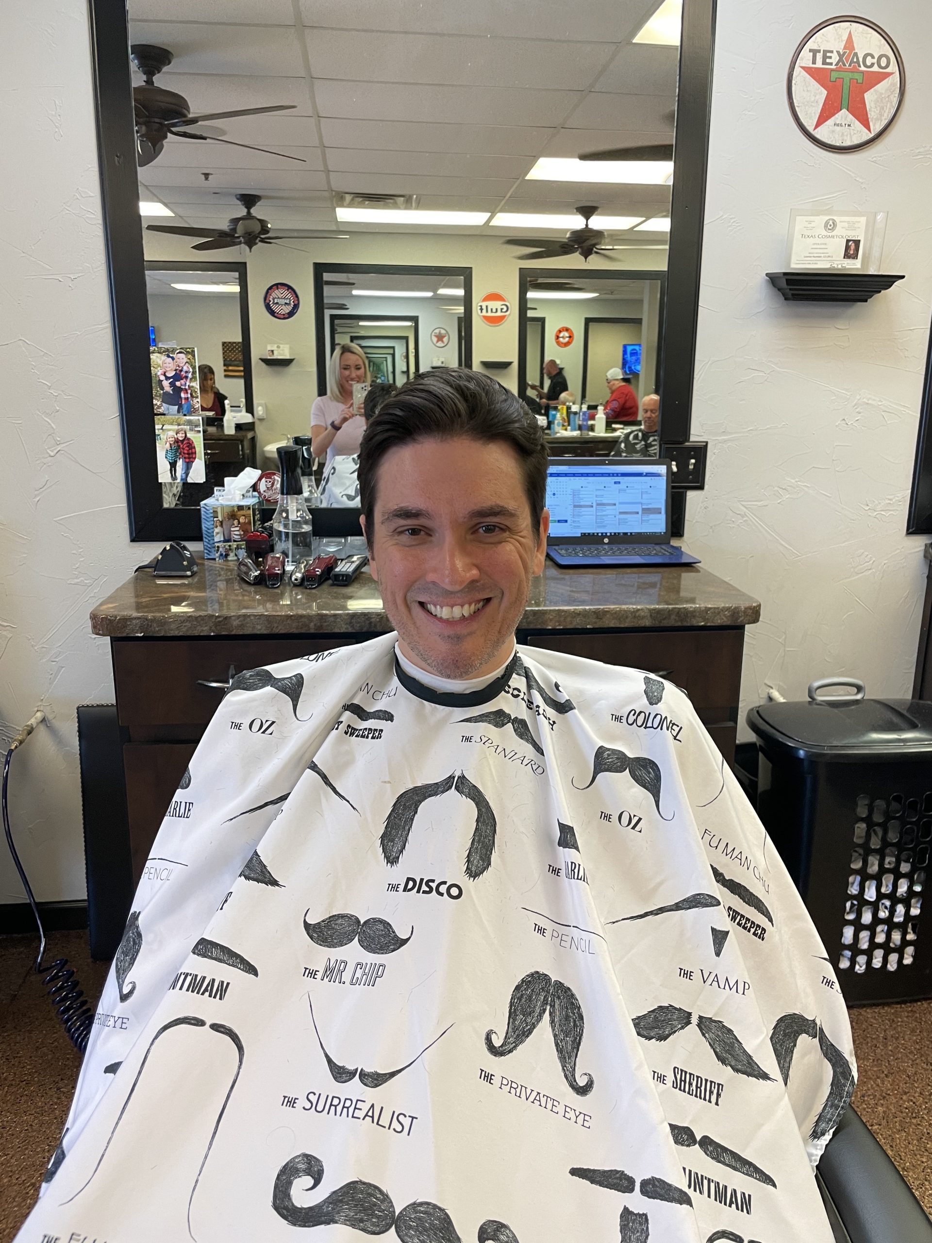 man smiling after hair cut