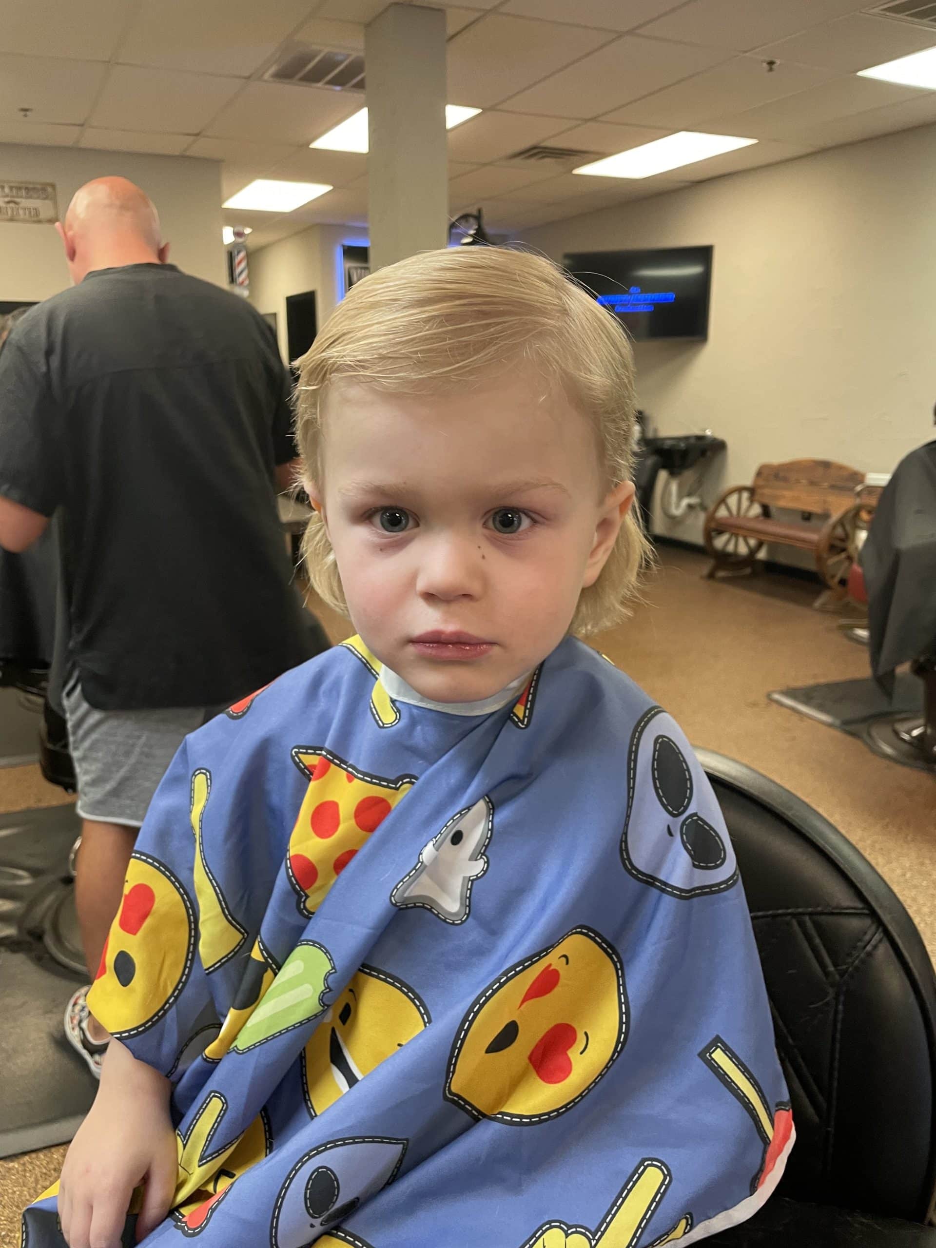 child after hair cut